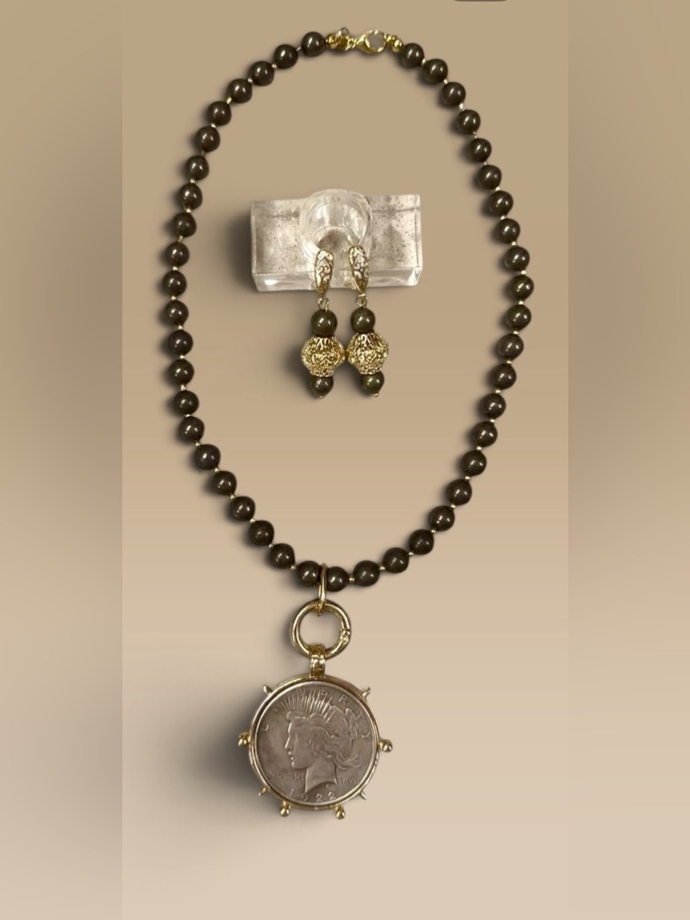 Large silver tone coin in gold tone setting on pyrite necklace with earrings
